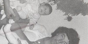 The Happy Parents: Stanley holding Justin while Patricia embraces Ronel